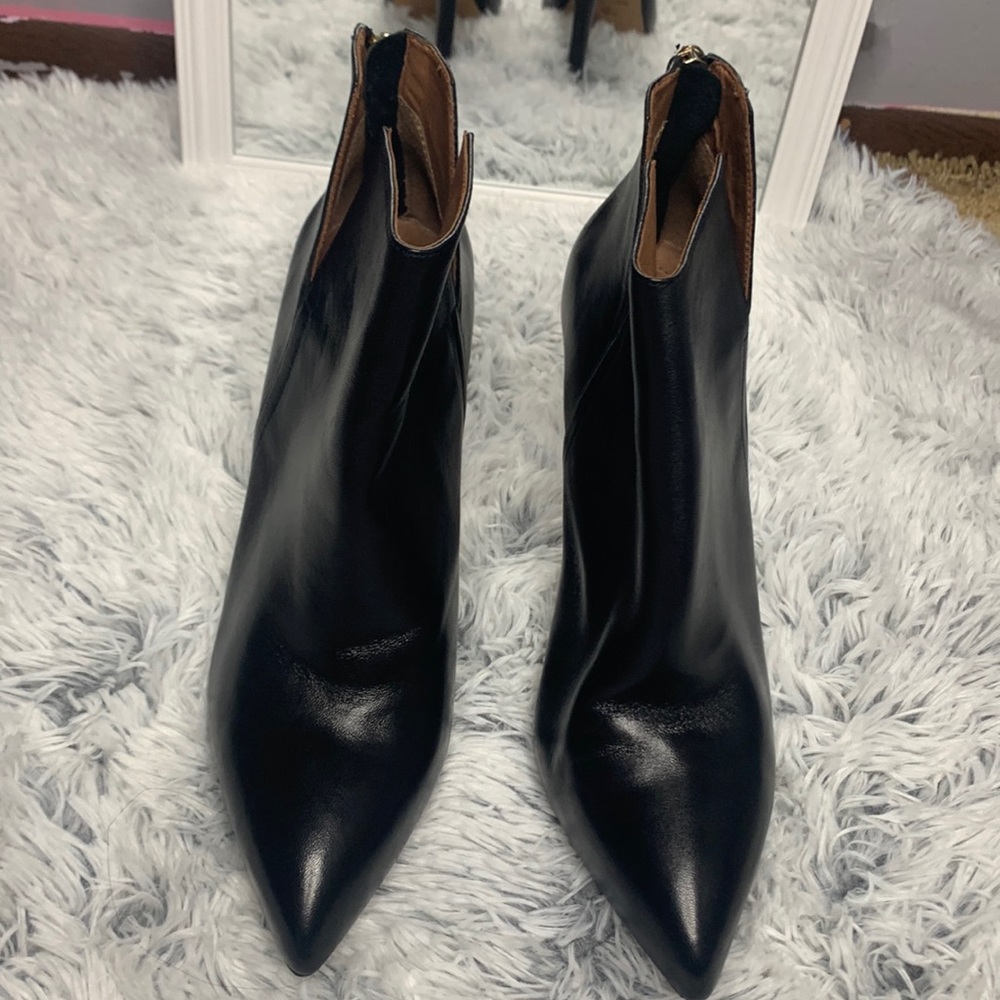 Black heel boots with gold zippers